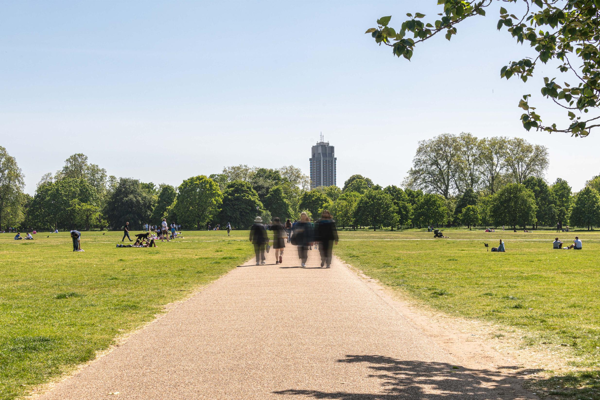 People walking down pathway in Hyde park